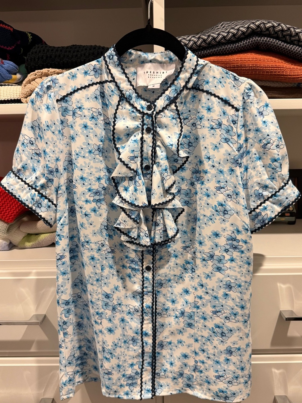 The Shirt by Rochelle Behrens Blue and White Floral Ruffle Blouse